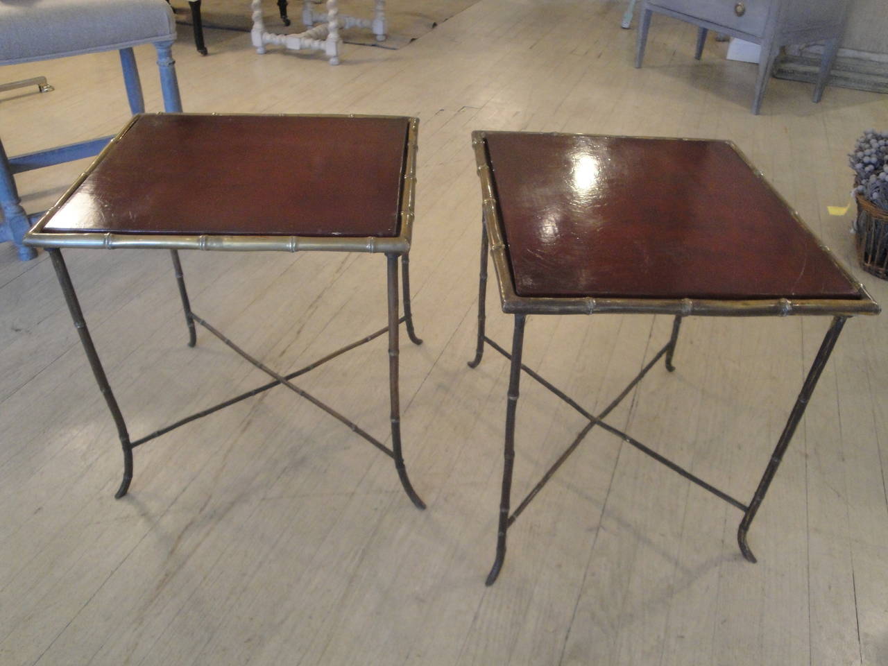 Pair of mid century French tables by Bagues in brass with lacquered tops and bamboo motif.