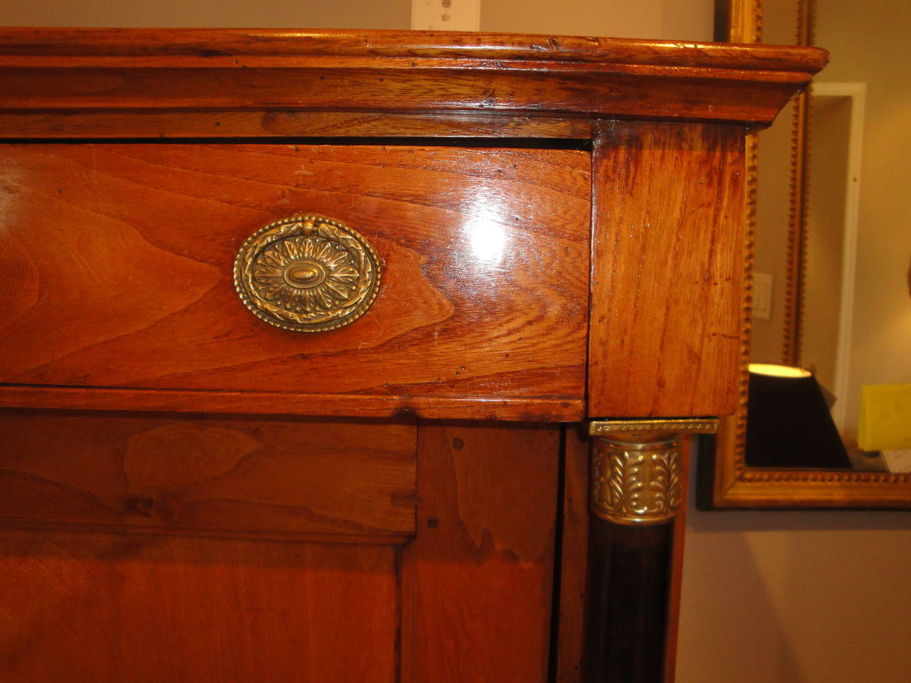French Empire secretary in cherry with architectural interior and ebonized columns with bronze doré fittings.