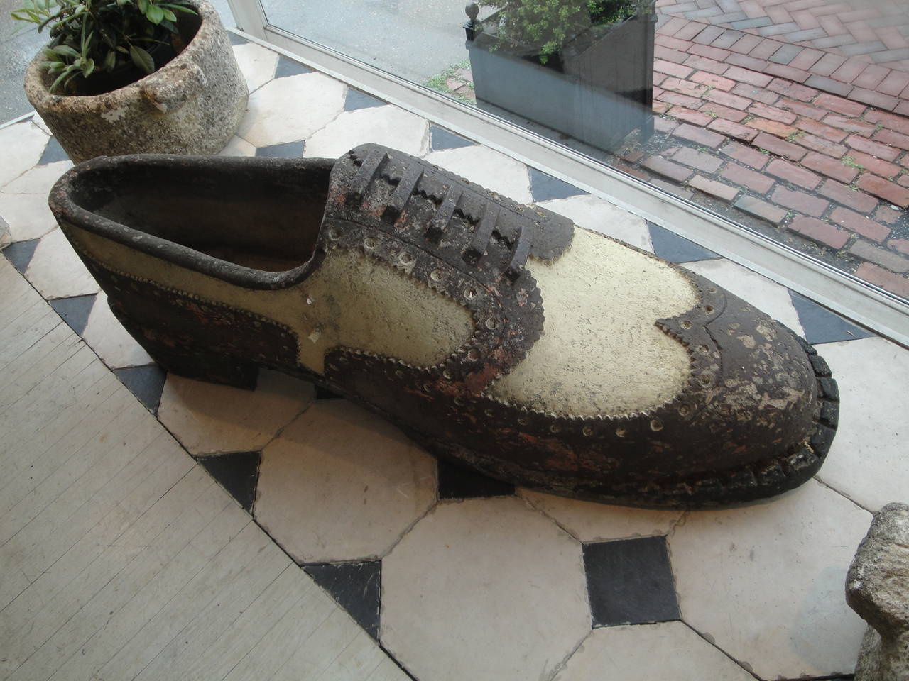 19th century French wing-tip shoe in concrete.