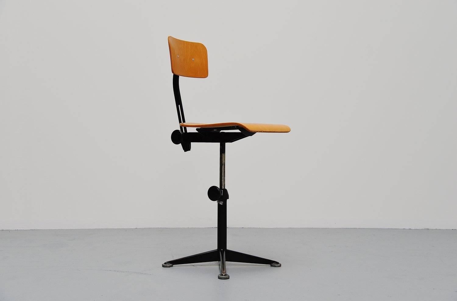 Fantastic set of drafting chairs designed by Friso Kramer for Ahrend de Cirkel, Holland, 1963. These chairs have rare and original black lacquered base and birch plywood seat and back. The seating height is adjustable and the back rest height is