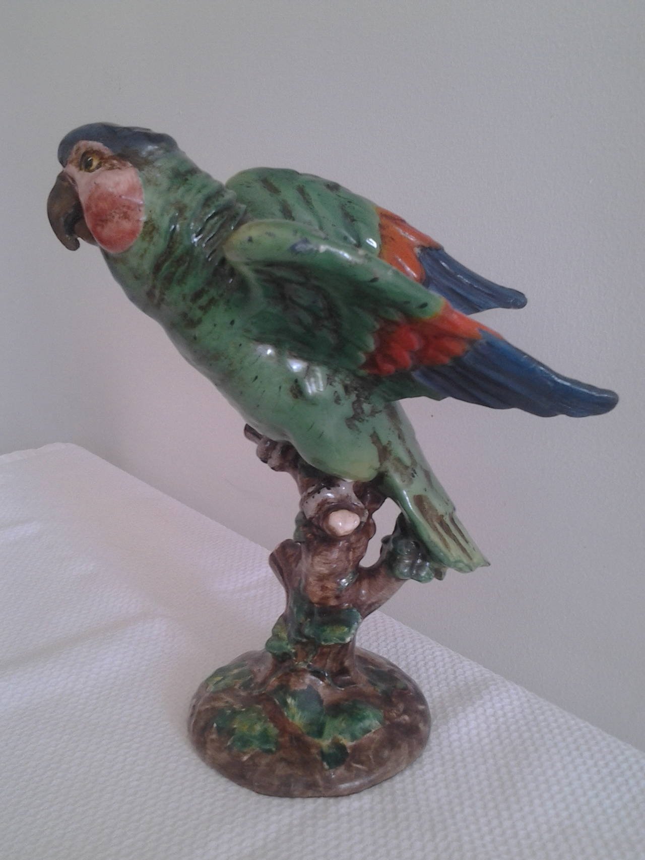 Ceramic parrot by Ugo Zaccagnini & Figli. The factory was founded in 1905, in Sesto Fiorentino, in 1912 they move the factory to Florence. Many sculptors and painters have collaborated with the factory, such as Contini, Martini and Ciardella.