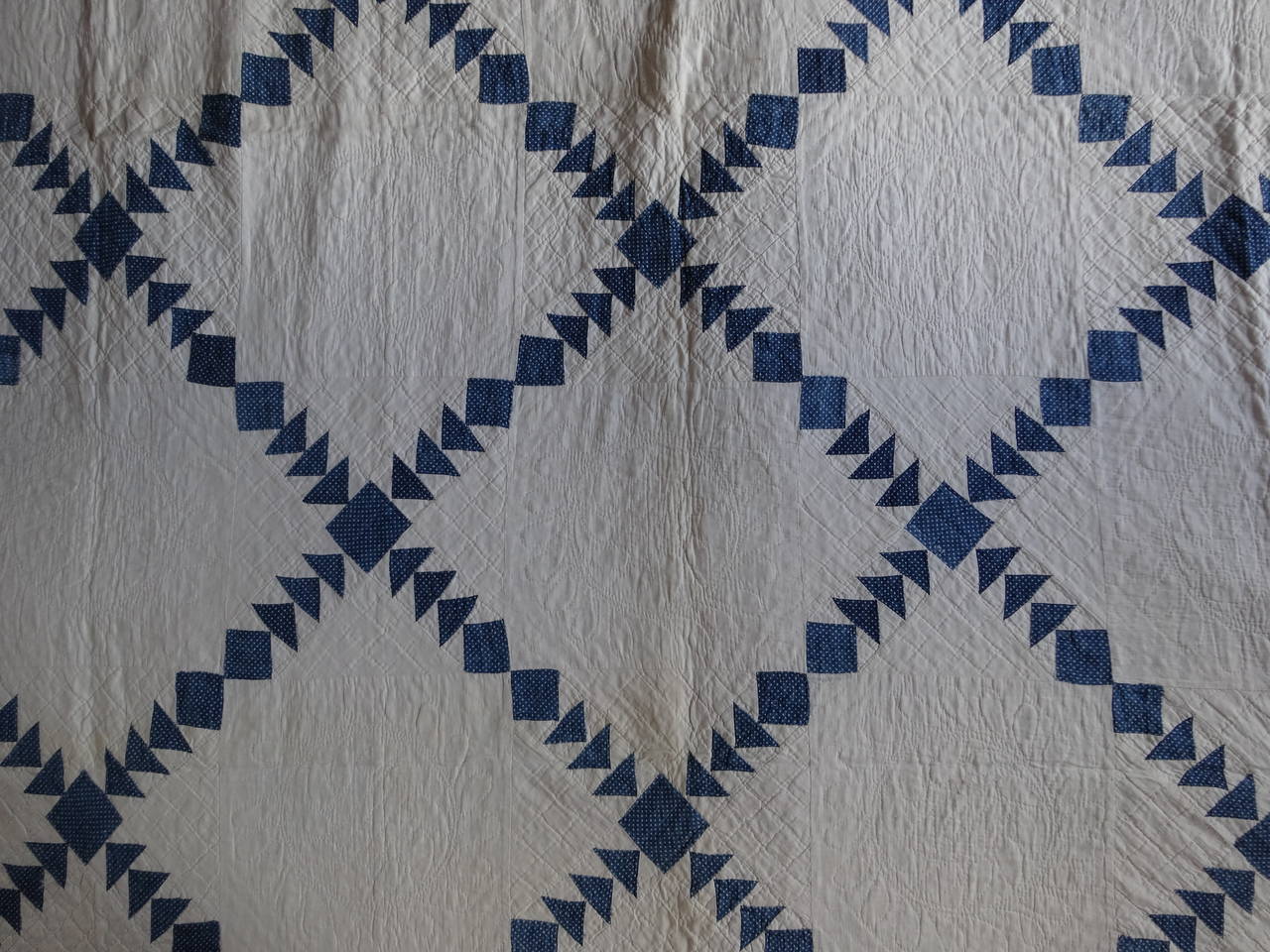 Diamonds in a Wild Geese Sashing Quilt 1