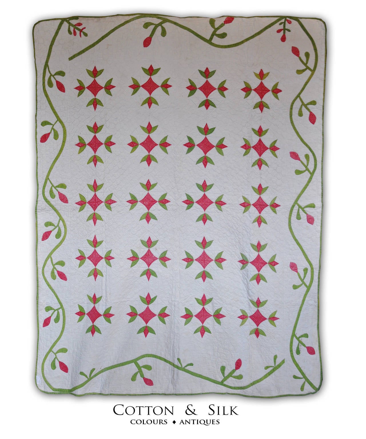 This is an applique quilt with red tulips on an arab tent ,surrounded by an elegant guirlande of buttonning flowers