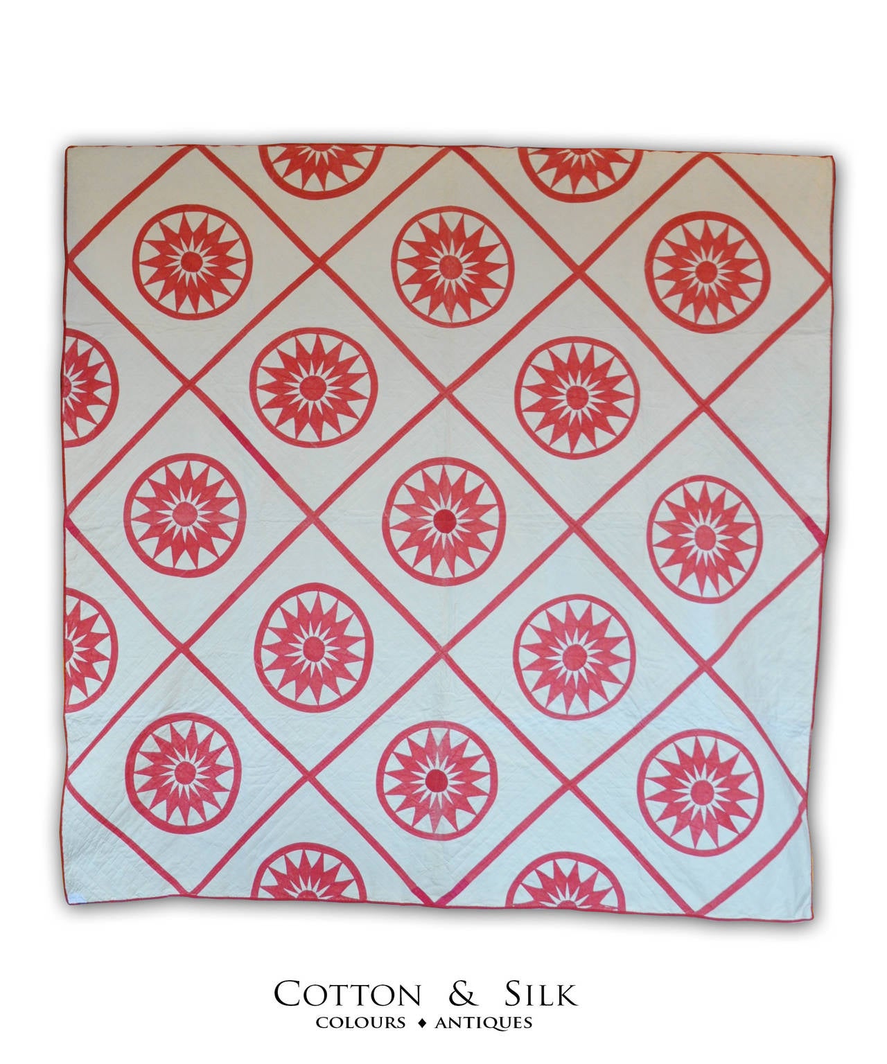 The turkish red of these  Mariner Compasses is of a striking freshness on the white background .This is a beautiful antique quilt with a modern look.