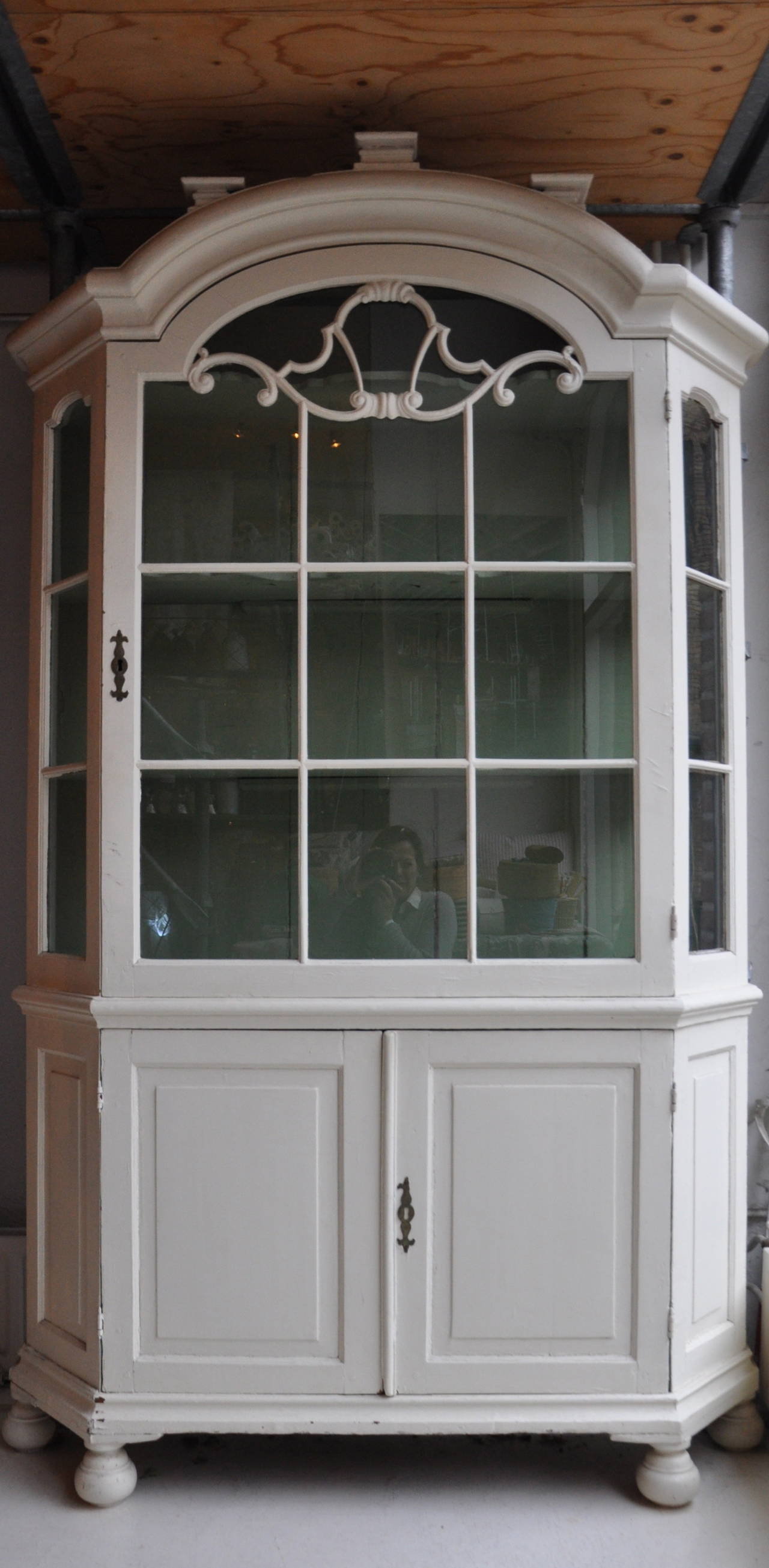 A Dutch display cabinet with a beautifully carved glass door.
The color of the paint inside is the original lime green color.
A cabinet with a very similar door was made circa 1740 and described in an important book about antique Dutch furniture