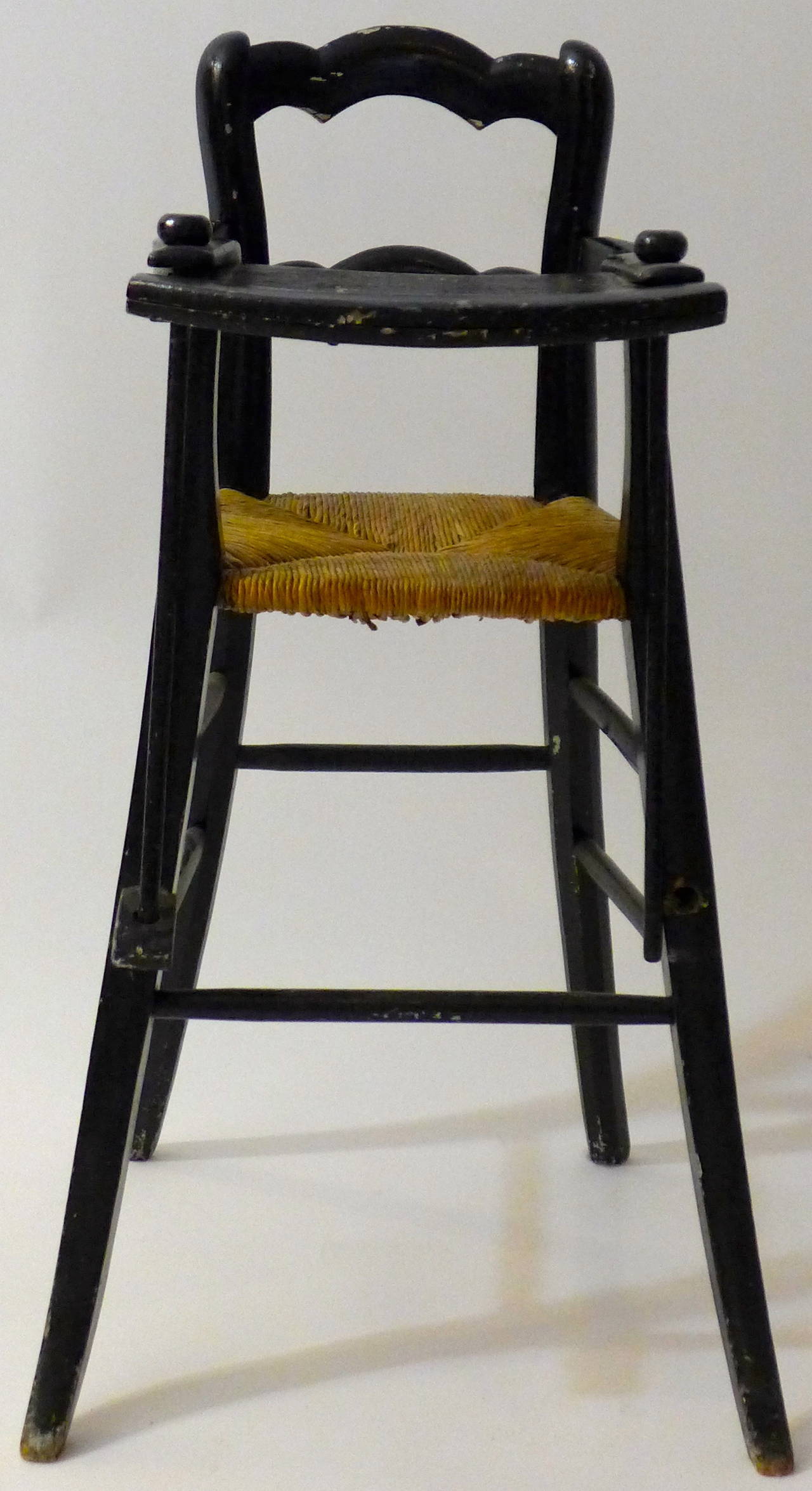 A 19th century Dutch high chair with rushed seat.