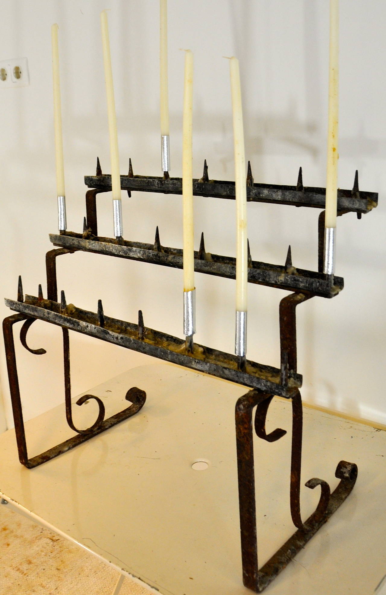 A charming sacrifice candleholder in iron from a church, somewhere in France.