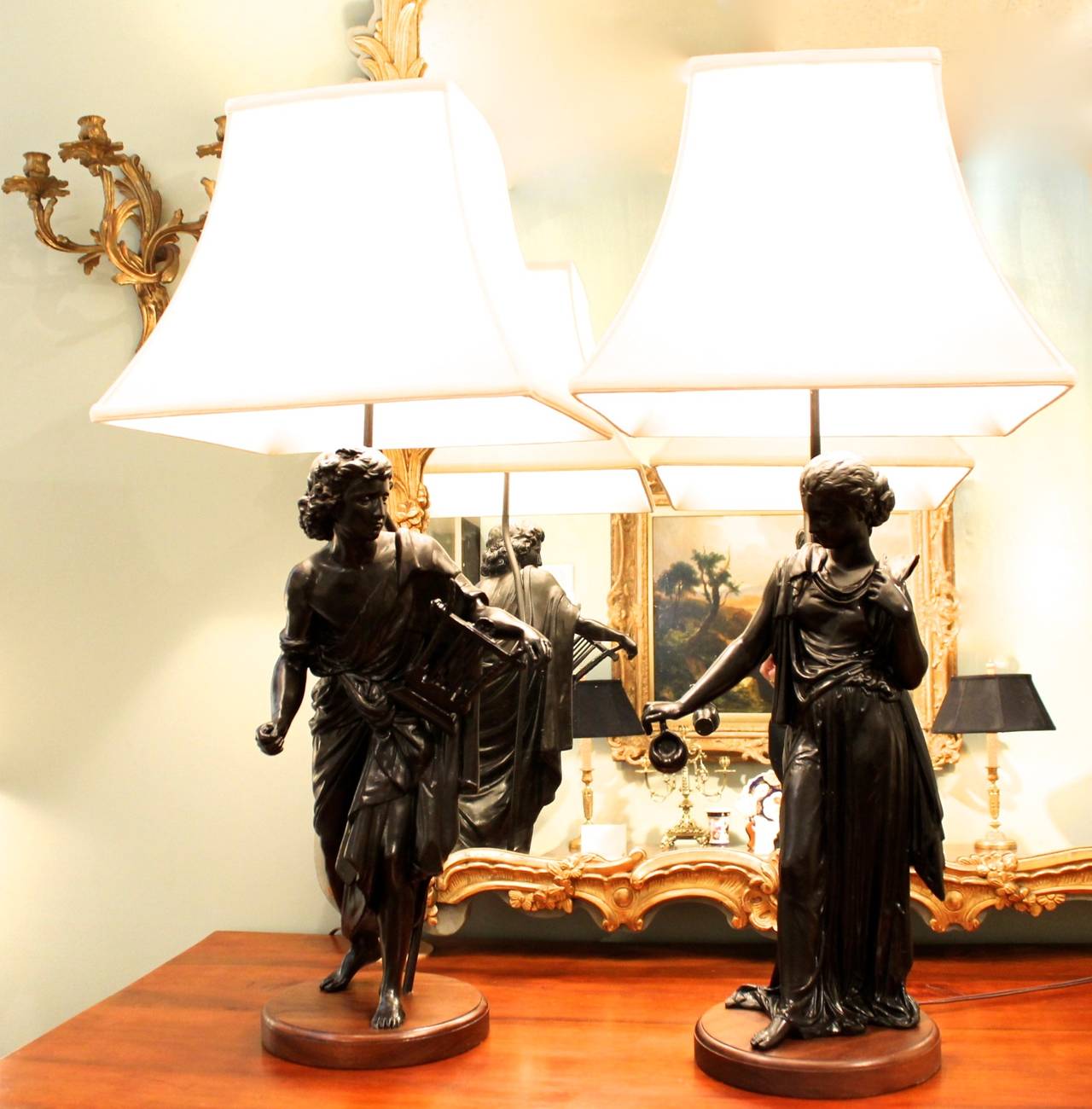 Patinated Pair of French Figural Lamps on Walnut Plinths For Sale
