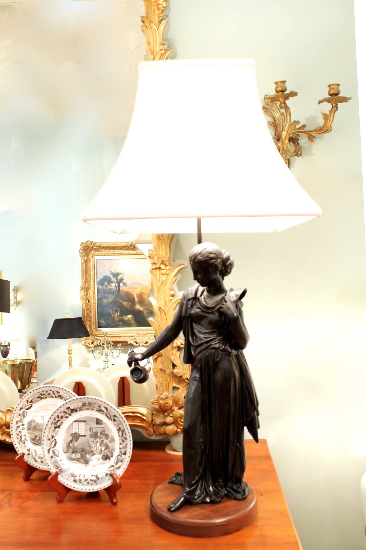 Spelter Pair of French Figural Lamps on Walnut Plinths For Sale