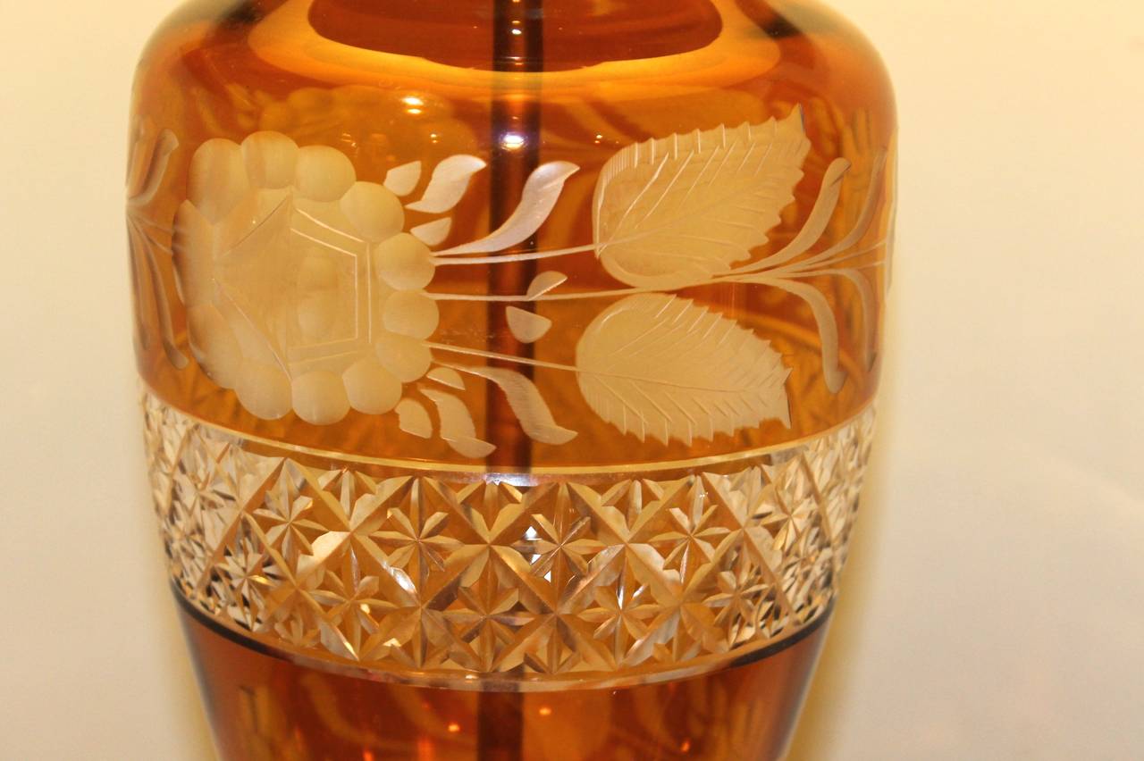 A graceful and tall Czech Bohemian crystal vase with encircling floral and beaded decoration, the center attractively belted in a clear faceted band. Ca. 1900, later adapted into a lamp on a decorative brass repoussé base. Two small chips to the