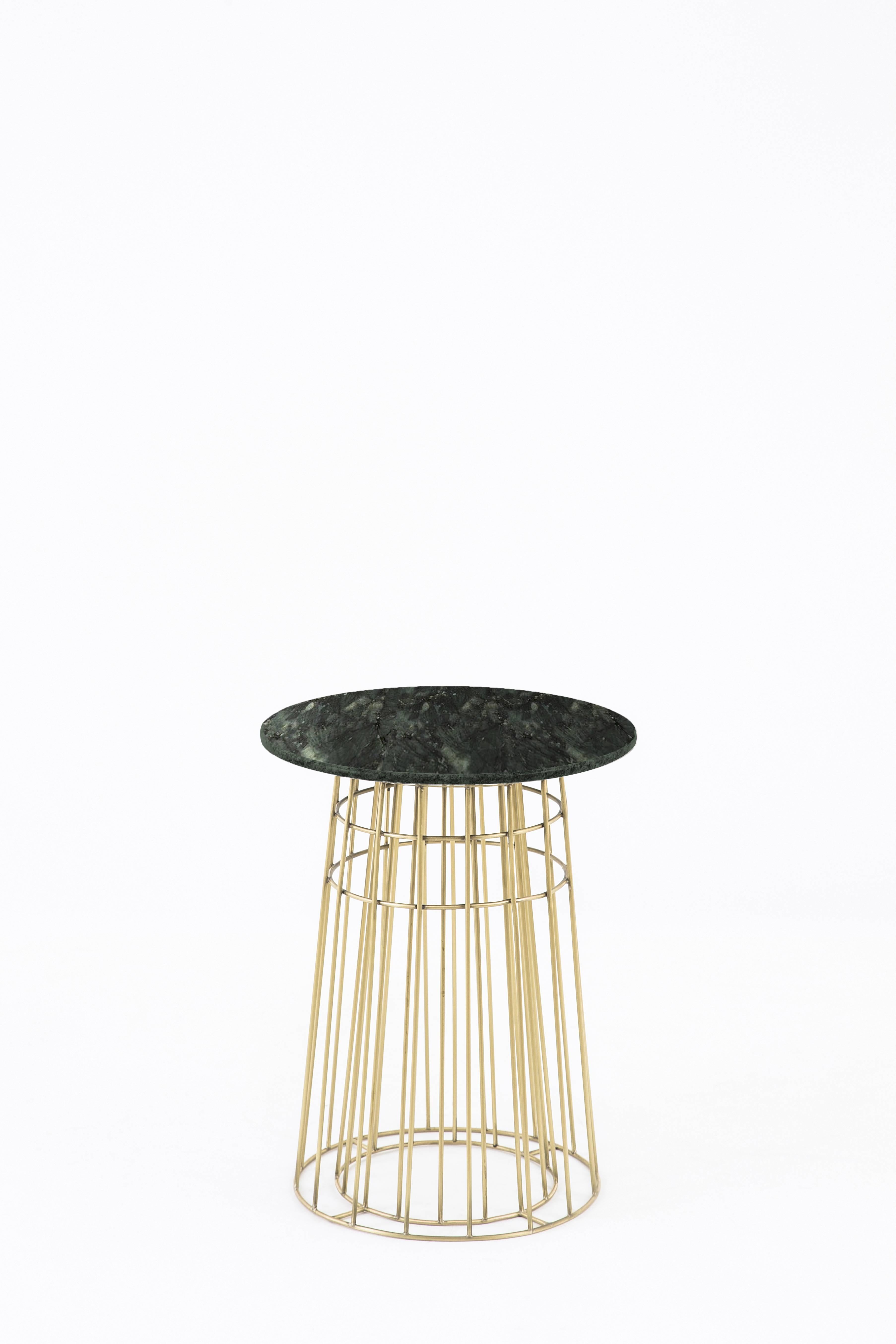 Contemporary delicate piece of art work in massive brass and Brazilian granite stone. The object was exposed in São Paulo and Paris, and was selected to appear in fashion and design review as Casa Vogue.
It can be used alone as a side table or