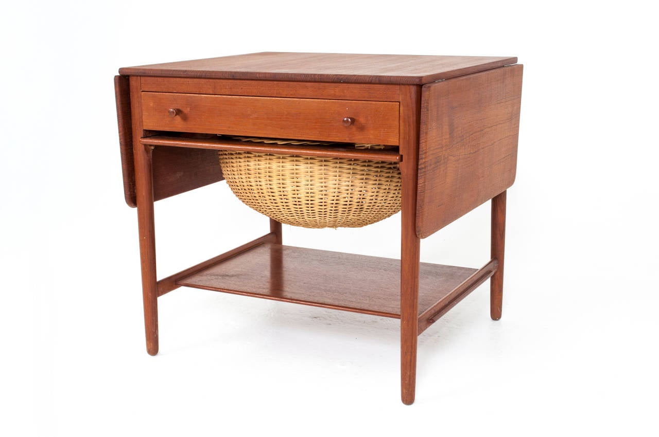Hans J. Wegner sewing table.
Model: AT-33.
Design 1959.

Solid teak and wicker.