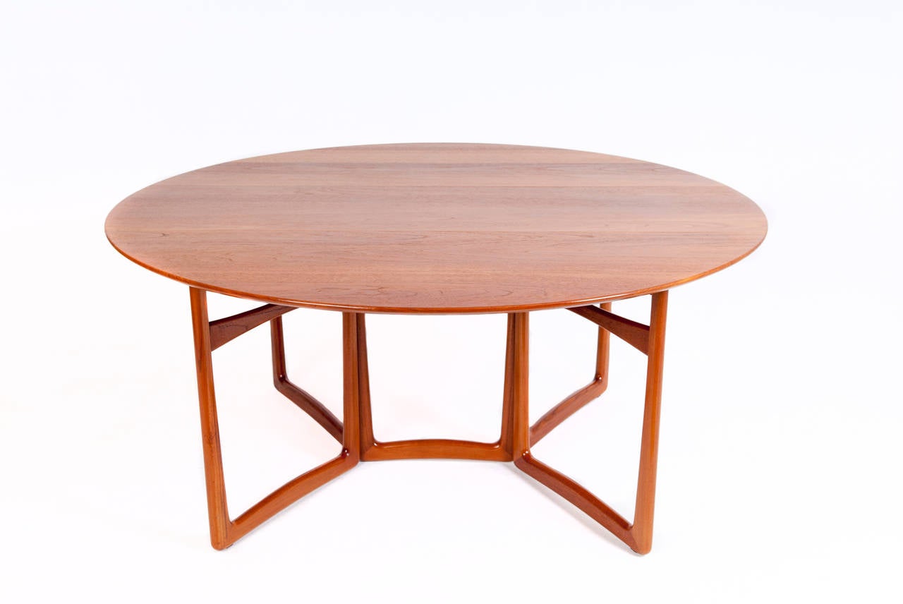 Peter Hvidt & Orla Mølgaard-Nielsen. Dining table or folding table, model 20/59, solid teak, top with two leaves, gate leg frame.

Designed circa 1955.
Produced by France & Søn. 

Measures: H 72, L 163 cm, W 45 - 143 cm.
