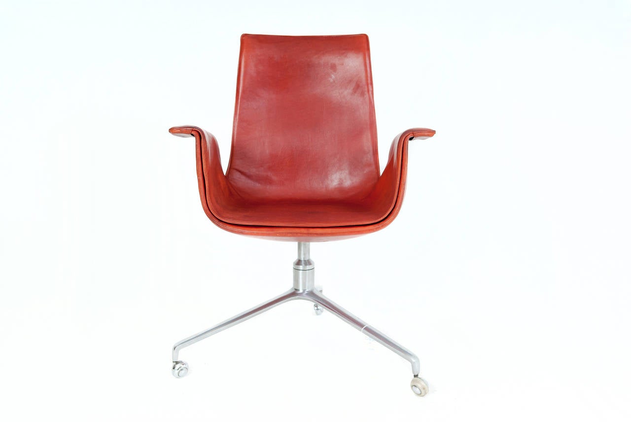 Preben Fabricius & Jørgen Kastholm armchair, tulip chair, model FK 6725. Fibreglass shell with patinated cognac leather upholstery, chromed steel tripod base. Designed in 1964. Produced by Walter Knoll.