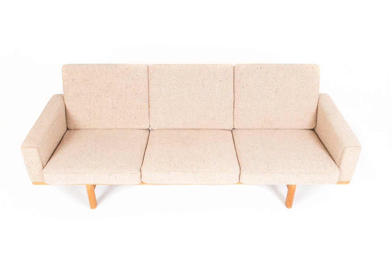 Hans J. Wegner Sofa model GE 236/3

Three seater sofa with frame of solid oak. Loose cushions in seat and back upholstered with wool. 

Designed 1959

Manufactured by Getama, Gedsted.
