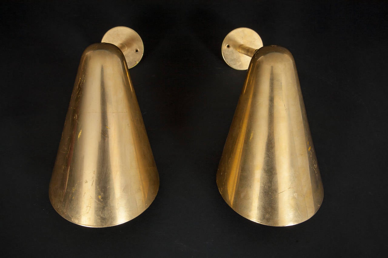 Pair of wall mounted lamps of patinated gold plated brass with adjustable shades

Probably manufactured by Louis Poulsen. ca 1940