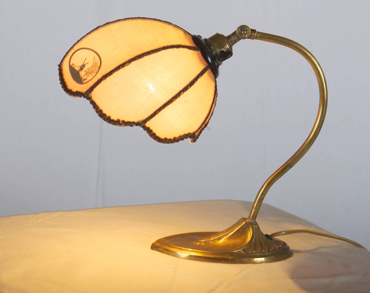 Art Nouveau Desk or Table Lamp.
Brass construction with silk lampshade and landscape motifs.
Some parts made of bakelite.