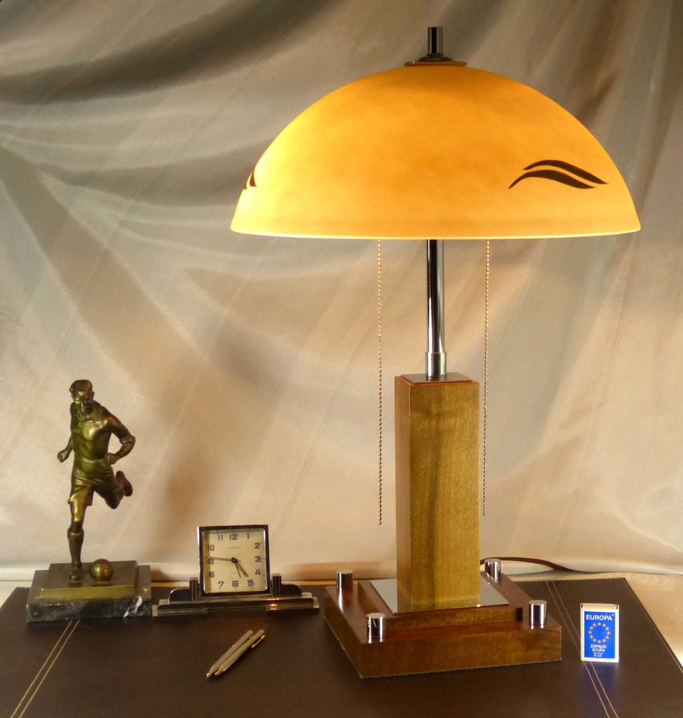 Old beautiful Art Deco table lamp, fully restored.
The entire lamp has a profile in the shape of a square column, with a square and basis with square-shaped hearth - wood Plywood covered with walnut, integrated into the body of the lamp base. This