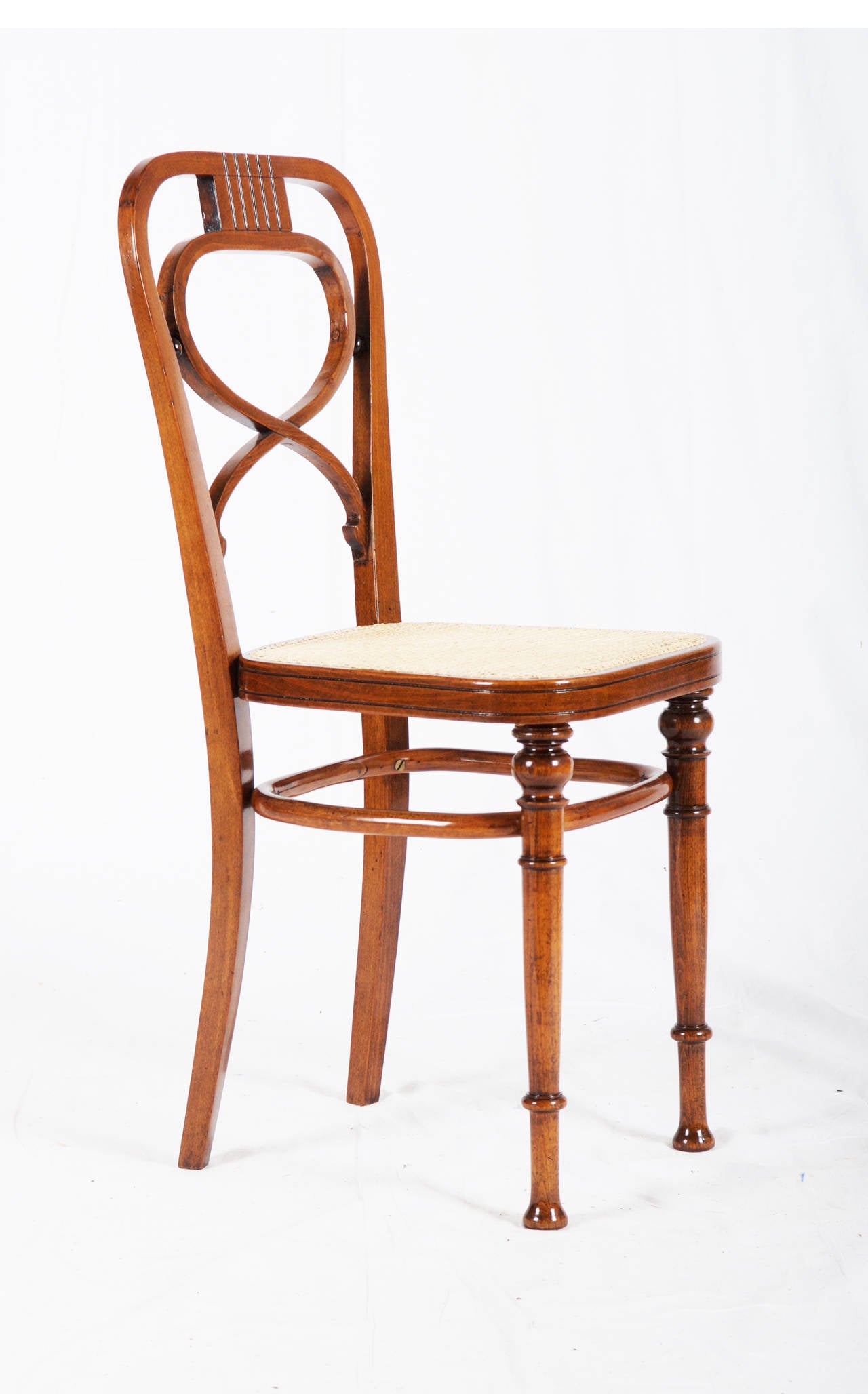 Rare Vienna Secession Thonet chair.
Beech bentwood walnut stained shellack finish with new canning.