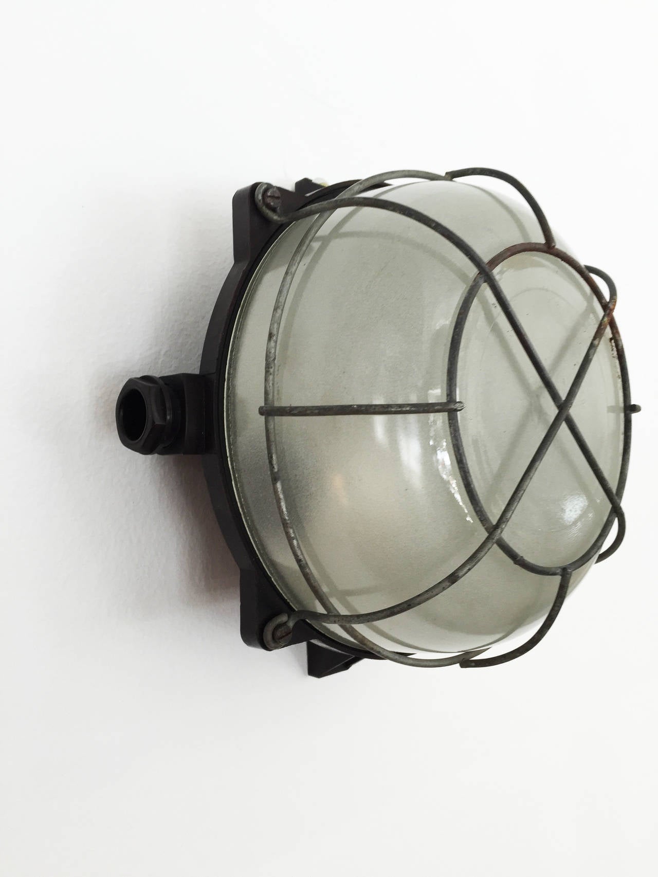 Bakelite wall of ceiling industial or factory lamp from late 1940s
up to 14 pieces available