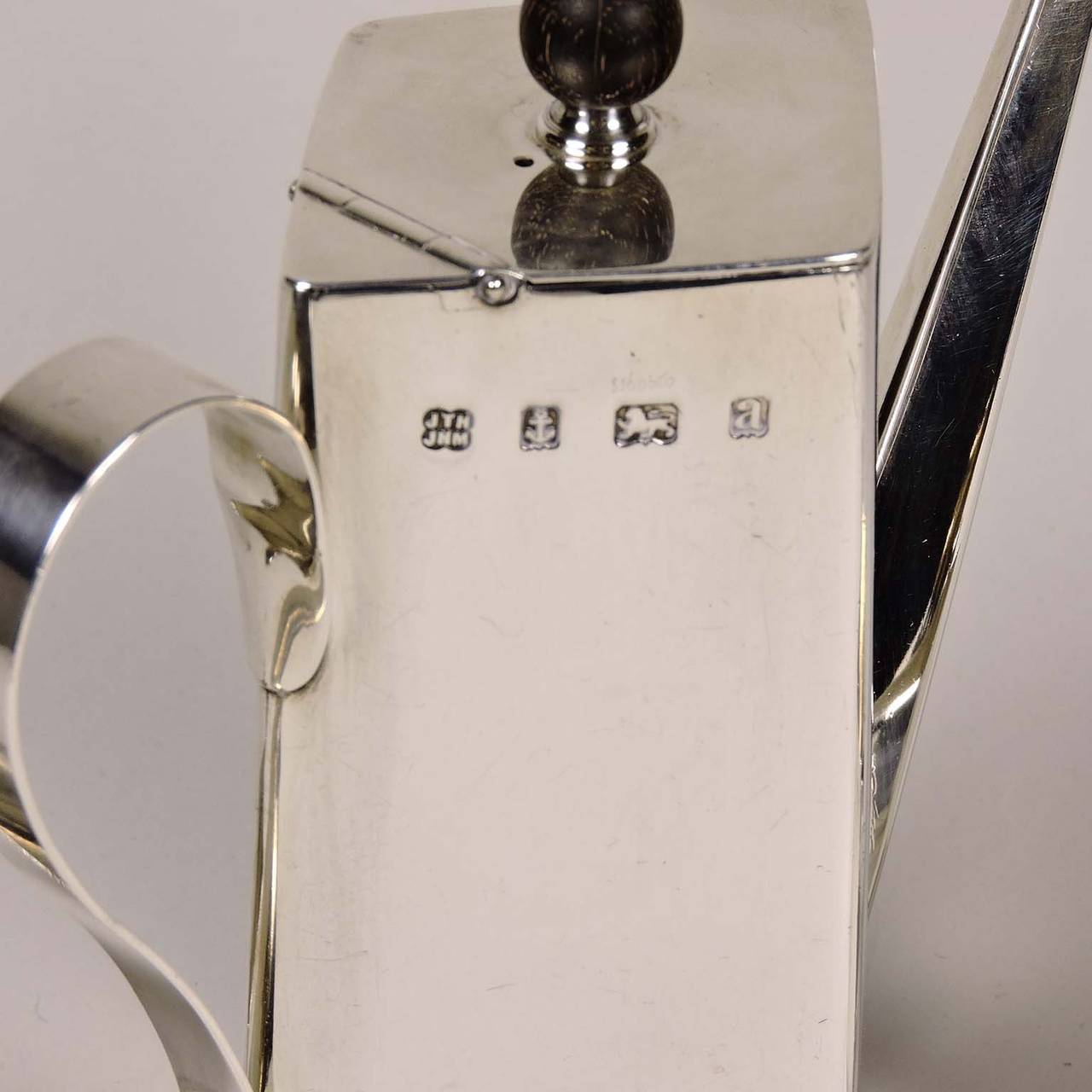 English Silver Three Piece Coffee Service, c. 1900.  Christopher Dresser design, marked JTH/JHM for John Thomas Heath & John Hartshorne Middleton, with sterling and Birmingham marks and date stamped for 1900.  Including a four sided coffee pot with