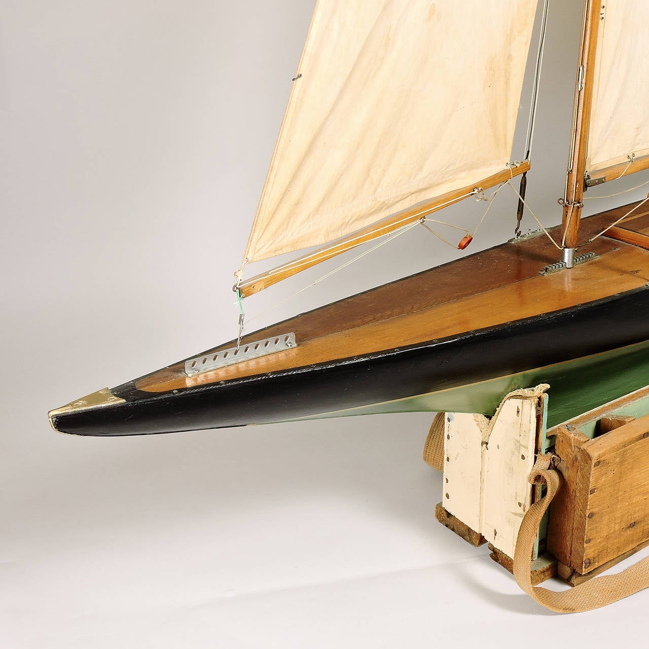 Superb vintage 20th century functional pond model of a sailboat on a custom carrying base marked 