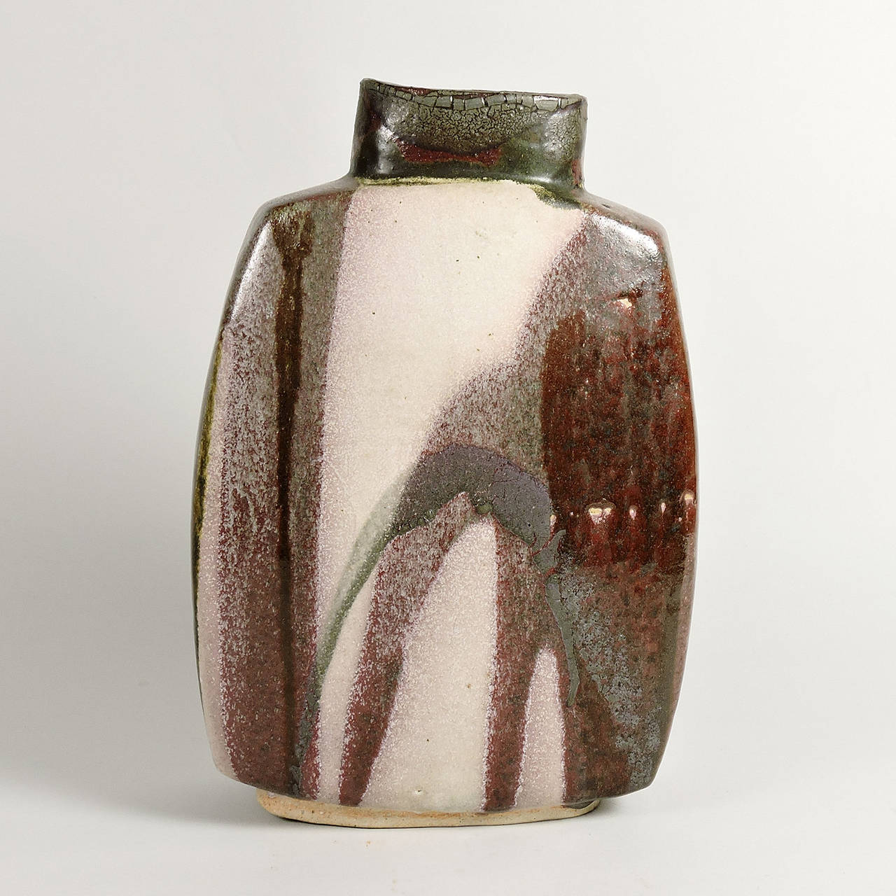 Doreen Blumhardt Slab Built and Poured Glaze Ceramic Vase, mid-20th century. 
Dimensions: 13 3/4 x 9 x 3 1/2 inches. 

Dame Doreen Blumhardt (1914-2009), worked as a ceramicist, becoming one of the New Zealand's most distinguished potters. She