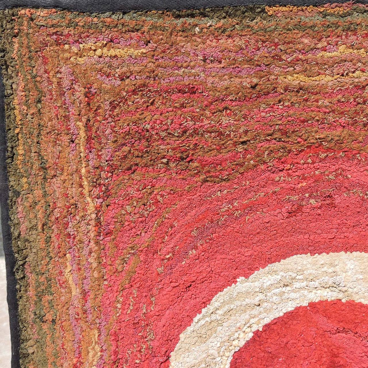 Rare antique red and white hooked rug (possibly Shaker) mounted as a wall decoration.
Dimensions: 46 x 29 1/2 inches.