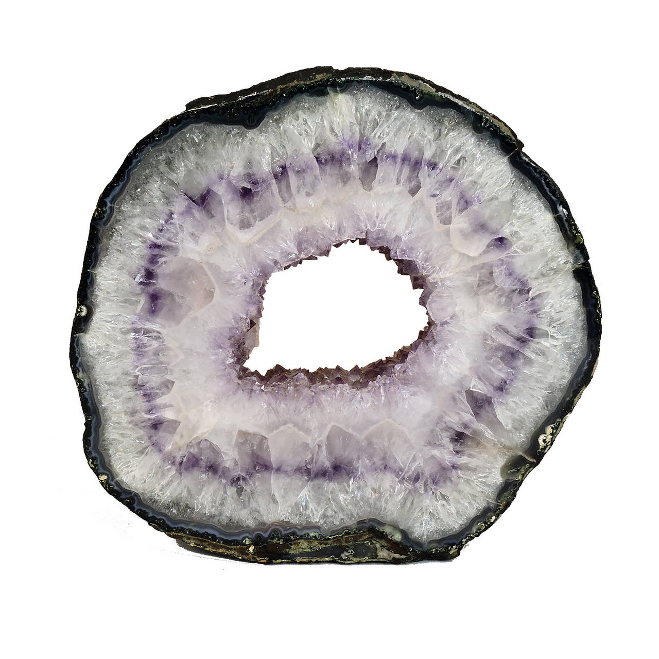 Exceptional cross section of a natural geode specimen with amethyst and gray hued crystals. 
Diameter: 10 1/2 inches.