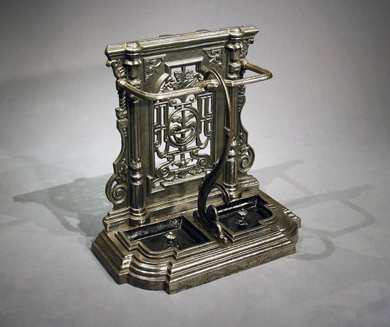 Quality shaped Victorian cast iron stick stand. This Victorian stick/umbrella stand is of the highest quality and has been polished to give a stunning look. The imposing stand is very decoratively carved having a shaped support and removable