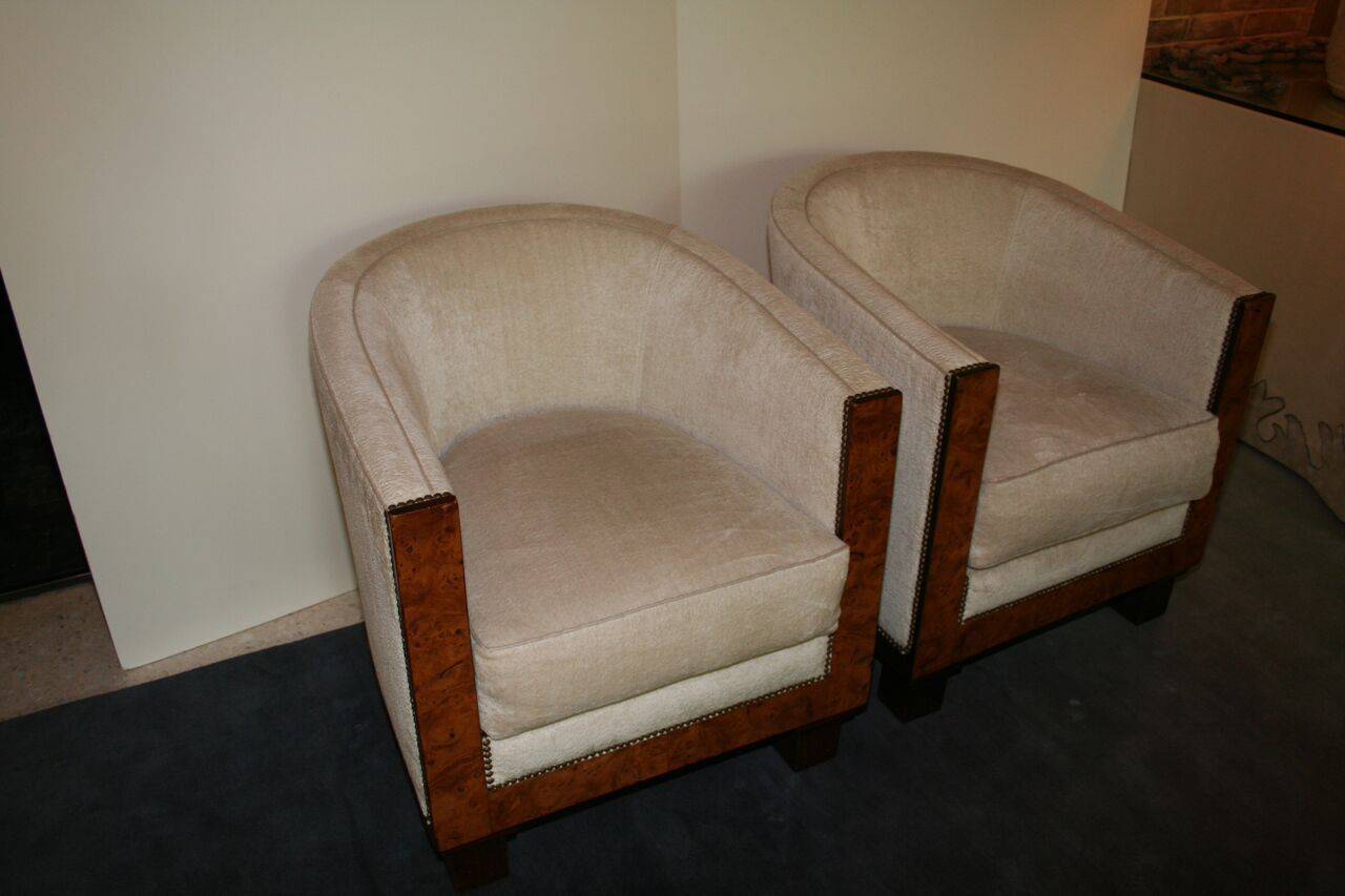 Pair of French 1930s Art Deco barrel chairs with burl wood front and new ivory upholstery.