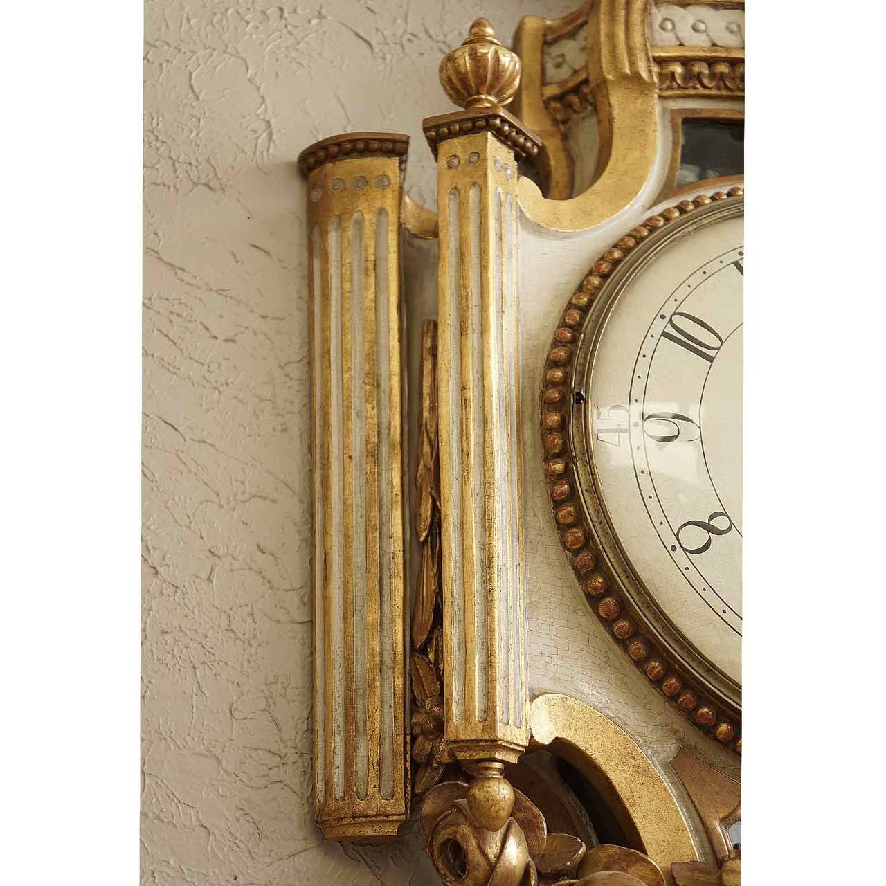 Exceptional, Swedish, 18th century Gustavian wall clock painted and gilded with beautiful detail in sheaves of wheat and garlands of roses. Perfect working condition. Recently cleaned and adjusted. Signed on the Face: Jacob Koch, Stockholm.