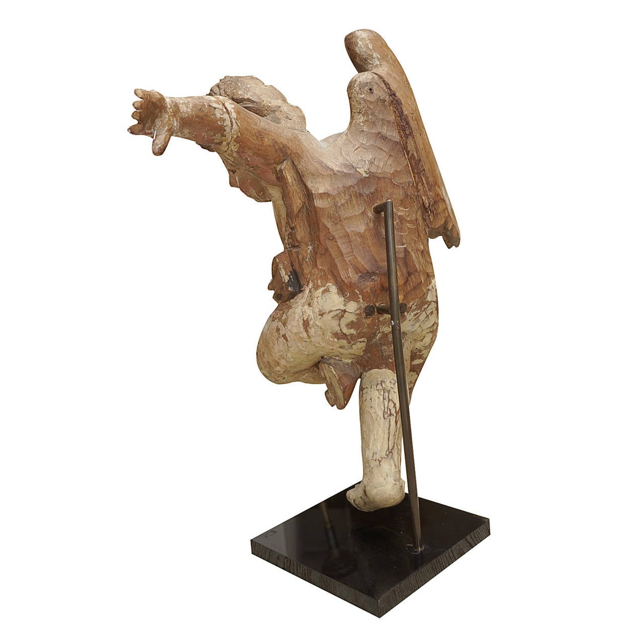 17th Century Italian wooden angel, exceptionally hand-carved to show a flow of motion. It is attached to a stand and is missing a wing as well as an arm. The surface is multi-colored paint on wood.