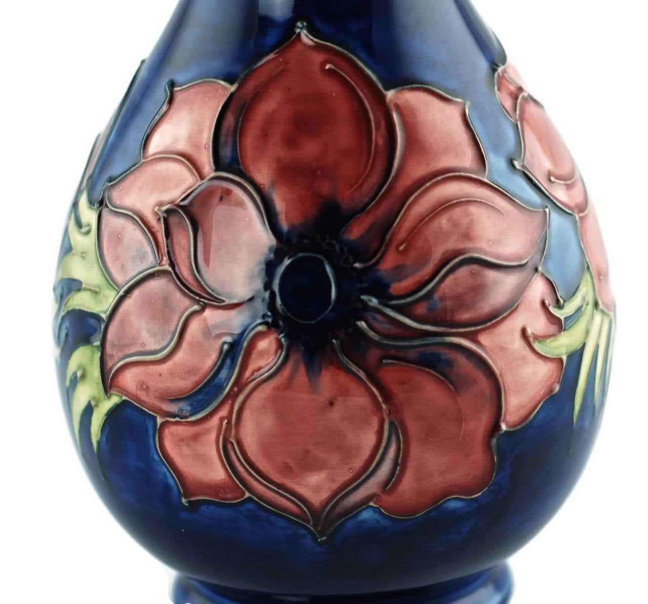 This striking English art pottery vase was made by the renowned Moorcroft Pottery company of Burslem, Stoke-on-Trent, Staffordshire. Initially in partnership with James Macintyre & Co., innovative ceramist William Moorcroft founded his own firm in