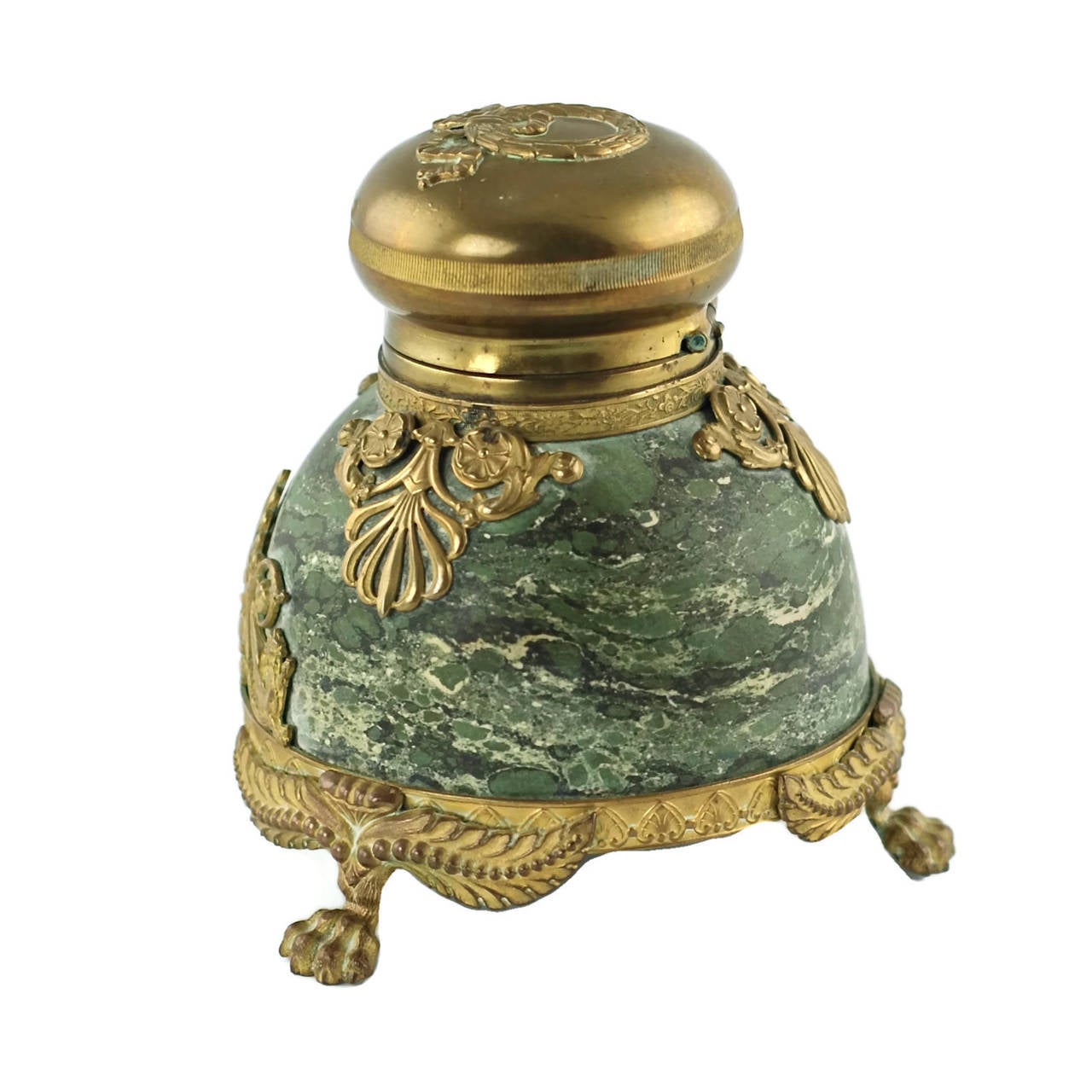 This 19th century French Empire inkwell is composed of richly veined Verde Antico marble finished in a dome shape with ornate bronze doré floral and foliate mounts. The front of the piece also features a pair of gryphon accents which flank a