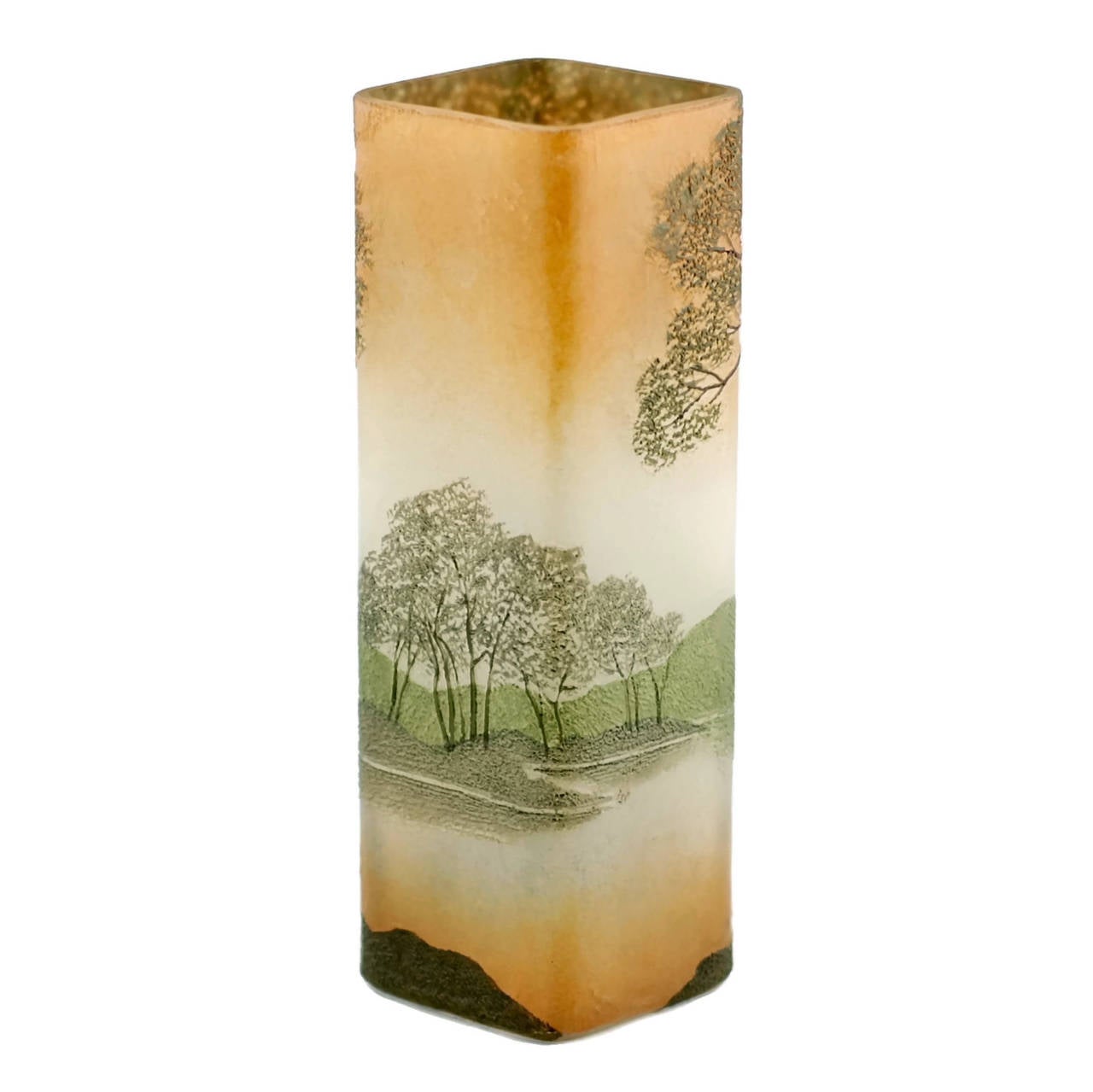 This early 20th century Art Nouveau enameled cameo glass vase was made by French art glass manufacturer Legras and has been executed in shades of brown, green and apricot. The piece has a square body featuring a landscape scene made up of delicate
