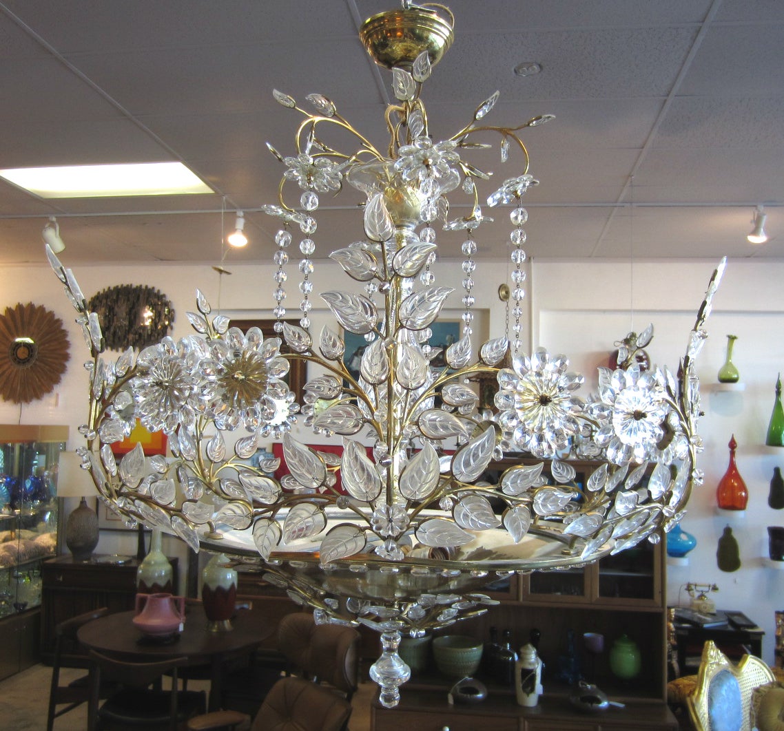 Stunning crystal chandelier by Maison Bagues of France.
Sculpted work of art floral & leaf design with large jeweled brass bowl bottom.
6 standard bulb center illuminates this hand crafted masterpiece.