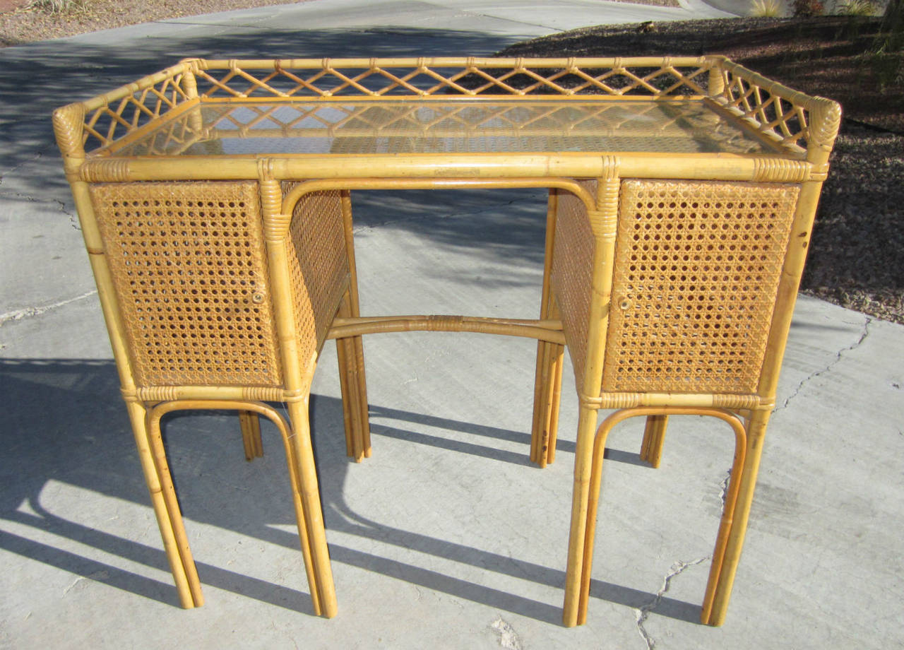Fabulous hand sculpted letter desk designed by Jean Royere. 
Cane frame with woven rattan. Glass desk top.
Completely original and unrestored with exceptional aged patina.