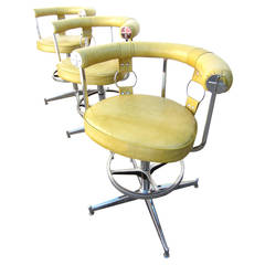 Trio of Hollywood Regency Chrome and Yellow Bar-Arm Stools
