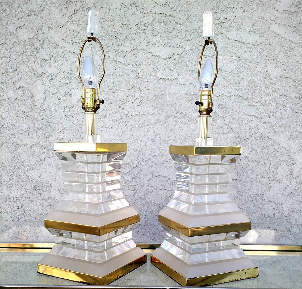 Late 20th Century Pair of Stacked Lucite and Brass Lamps, circa 1970s Hollywood Regency