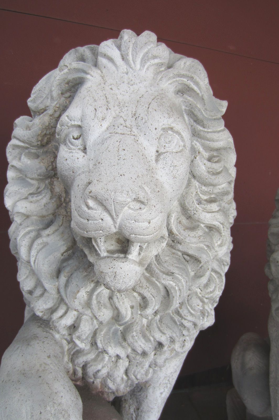 A pair of large antique lion sentinels.
Exceptional detail formed of solid cement. 
Over 3 feet tall and weighing 200lbs each.