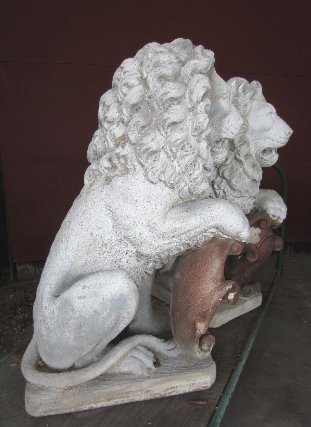 concrete lion statues pair