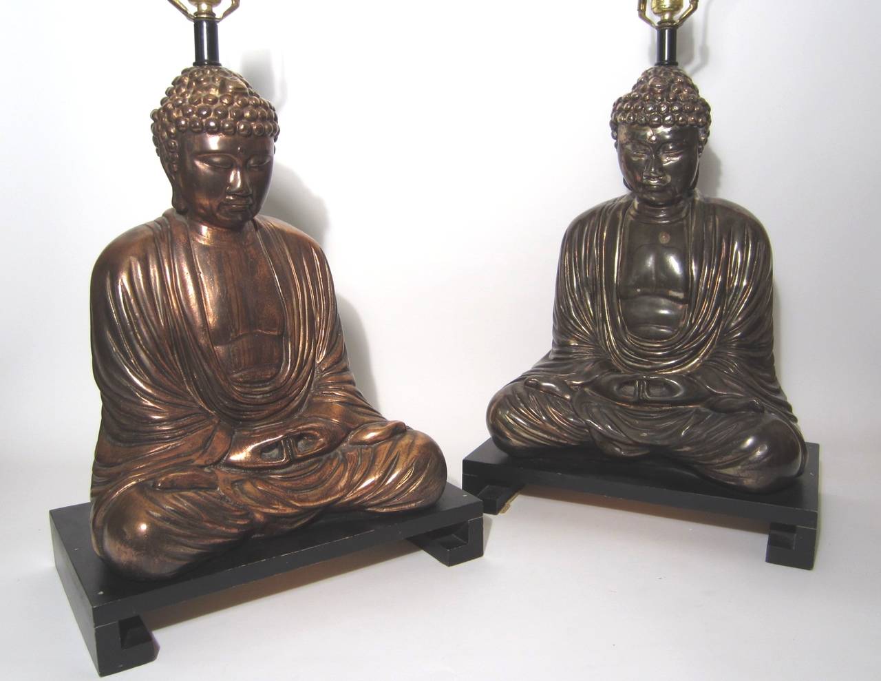 Incredible pair of vintage lamp, circa 1950s.
Polychromatic finish, one aged copper the other tarnished silver.
They are large, heavy lamps on ebonized wood base's.
Each has original cloth covered shades in perfect condition.
 