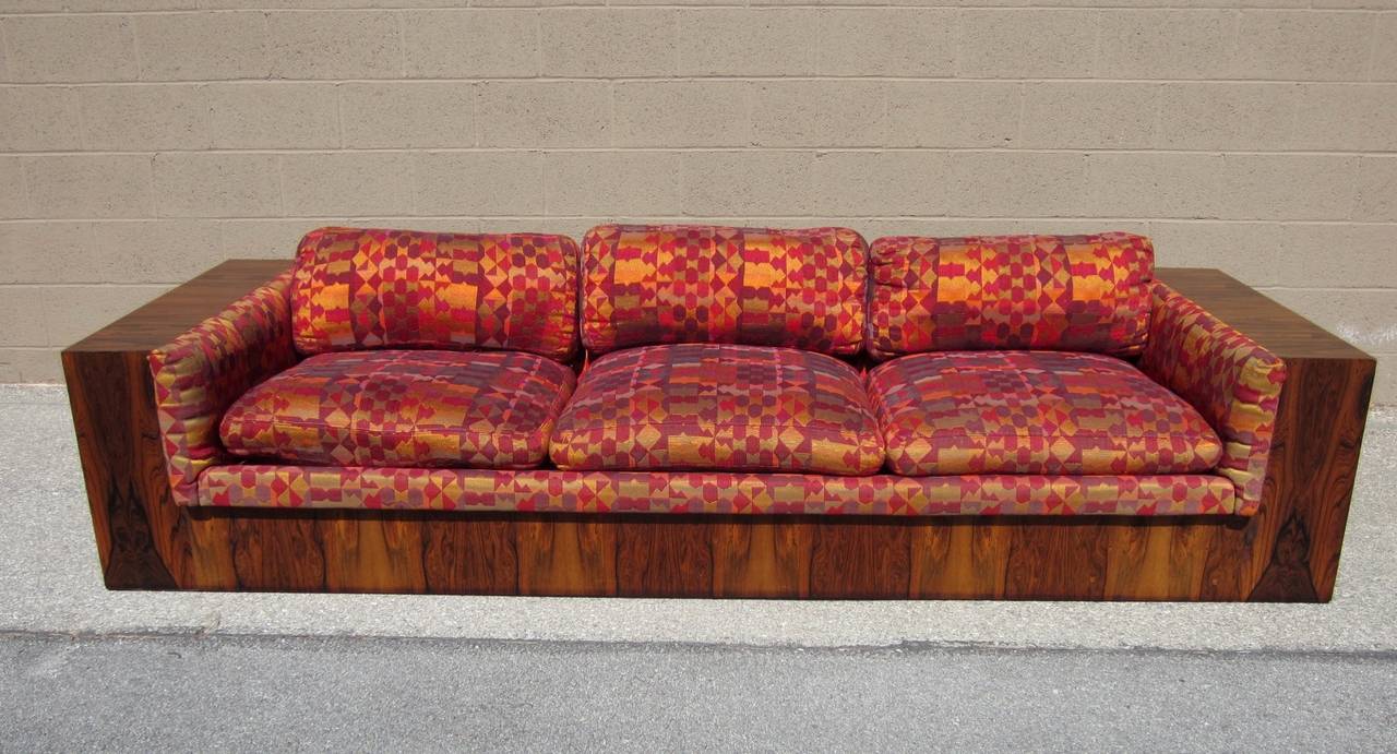Incredibly gorgeous Mid-Century Modern rosewood sofa by Milo Baughman with original Alexander Girard upholstery by Thayer Coggin.
Measures 8-1/2 feet long. Dated 1968.
Solid and in very good condition.
Tiny veneer chips shown in pictures at base