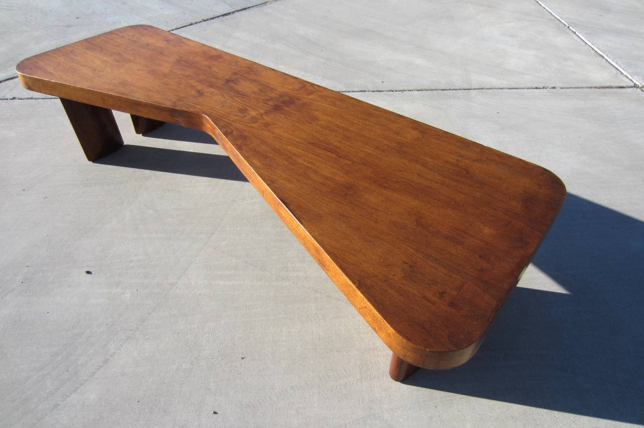 Incredible modernist coffee table measuring 6 feet long.
Biomorphic top with three big foot legs. Made of think mahogany.
Exceptional piece of mid-century art furniture.
All original and unrestored. Not signed.