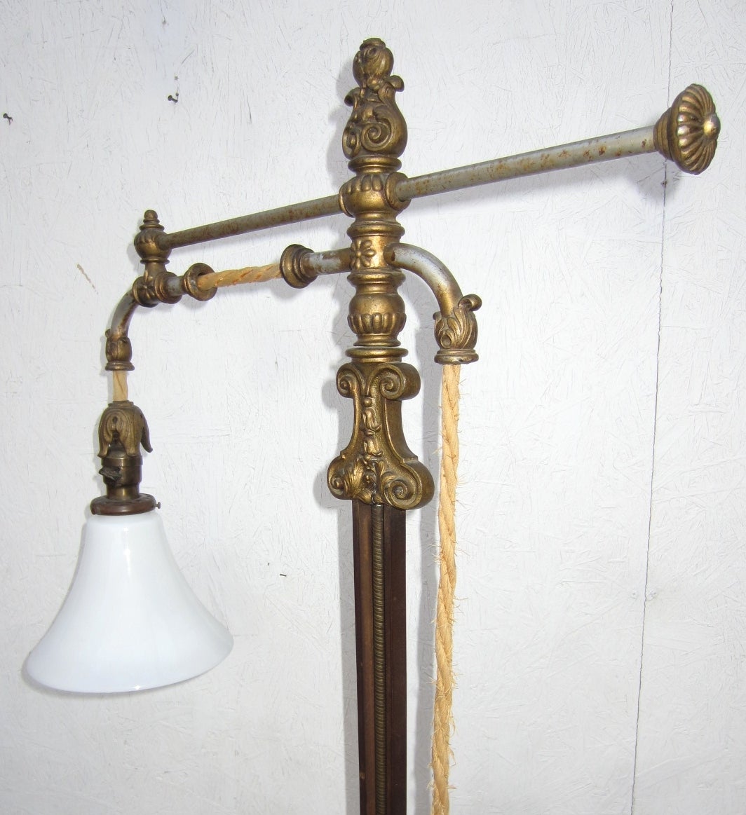 Incredible floor lamp which moves forward and back and up and down via a push rod and hemp rope with weighted tassel(see pictures).
Heavy steel and iron construction with black marble base. 
Fluted milk glass shade.
Provenance, from Masonic lodge