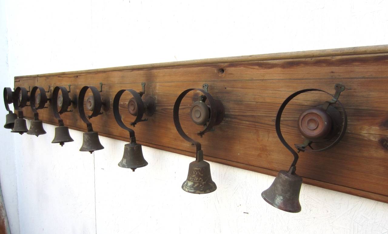 Incredible set of servants bells from a stately English estate circa 1870s.
All original pieces mounted on an 8-1/2 foot long board complete with pulley and wire.
Solid bronze bells graduate in size, each numbered on top. They sound fabulous!
A