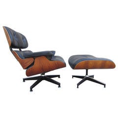 Mid Century Herman Miller Rosewood Lounge Chair and Ottoman by Charles Eames