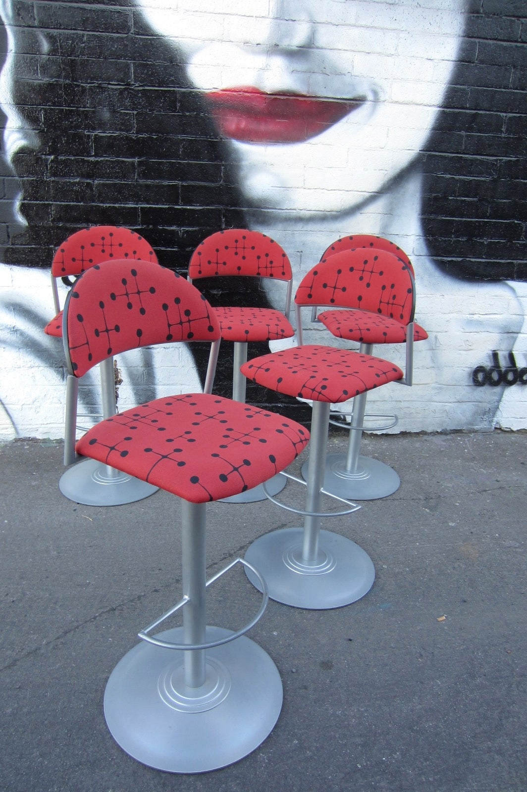 Set of five Memphis era bar stool upholstered in Knoll fabric designed by Charles & Ray Eames.
Heavy, high quality solid steel stools which are very solid with footrest.