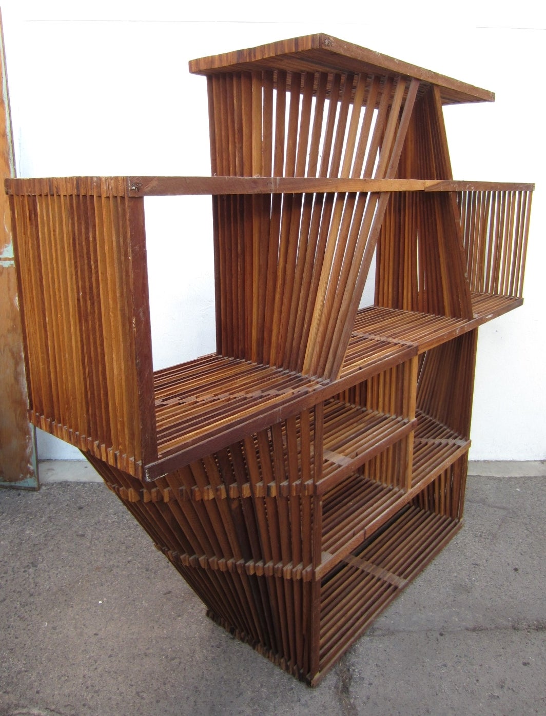 An amazing, highly architectural wood lath wall unit attributed to Cliff May, circa 1940s-1950s
A very large piece in original condition.